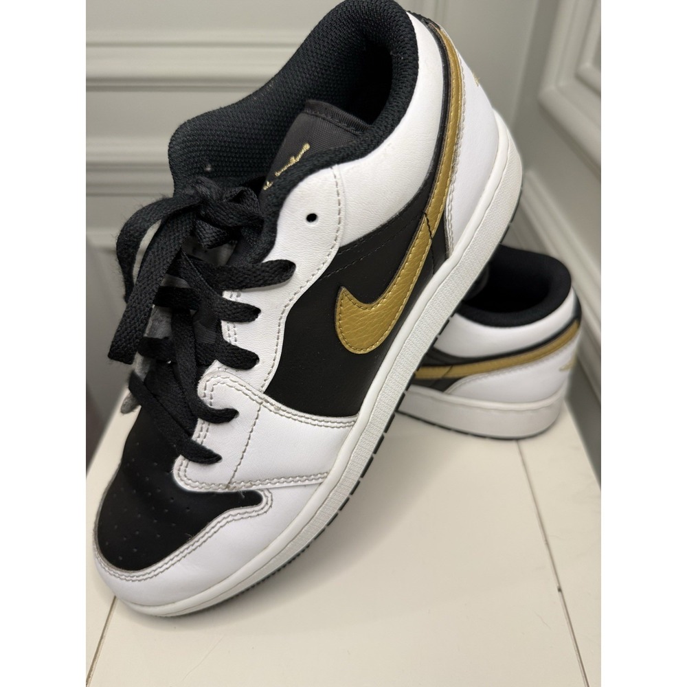 Air Jordan 1 Low in the "Gold Swoosh" White/Metallic Gold-Black